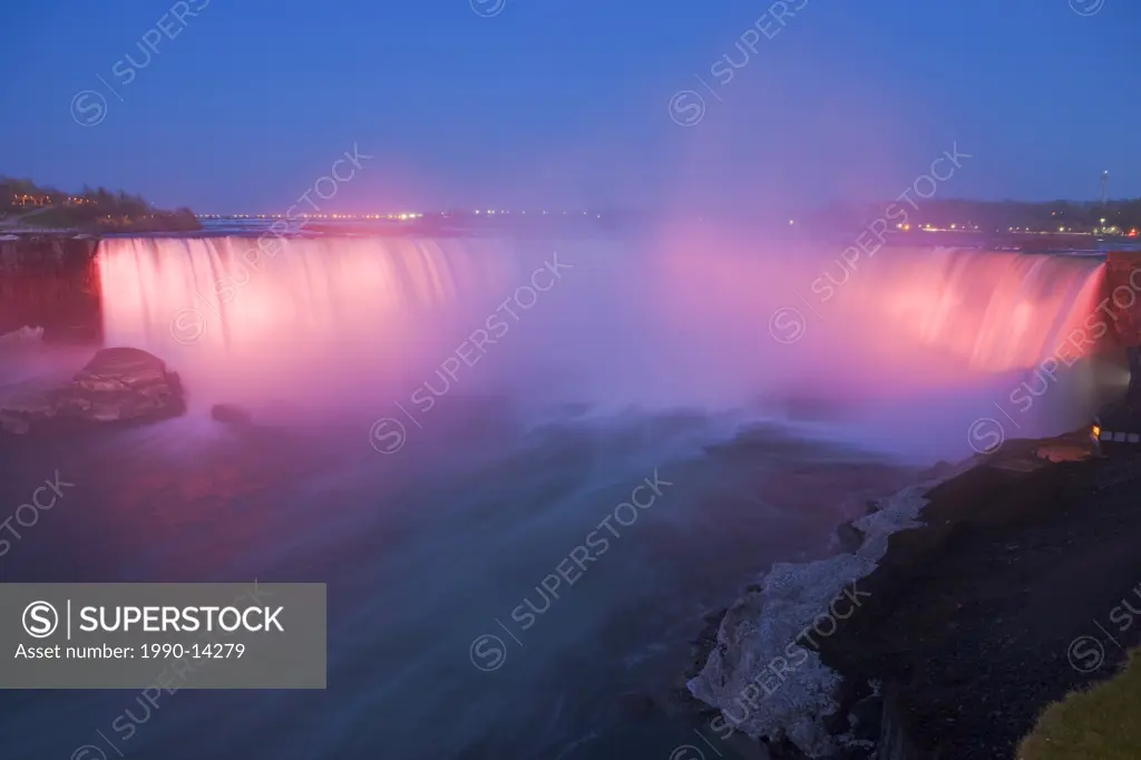 Horseshoe Falls along the Niagara River at dusk during the nightly illumination, Niagara Falls, Ontario, Canada