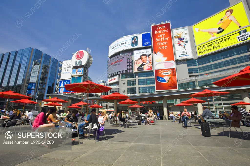People relaxing in city plaza, Yonge_Dundas Square, downtown, Toronto, Ontario, Canada