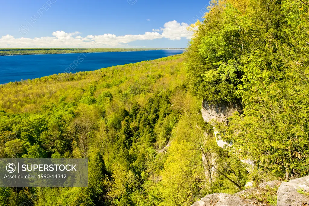 The cliffs of the Niagara Escarpment from the Bruce Trail with Colpoys Bay in the distance, Georgian Bay near Wiarton, Ontario, Canada