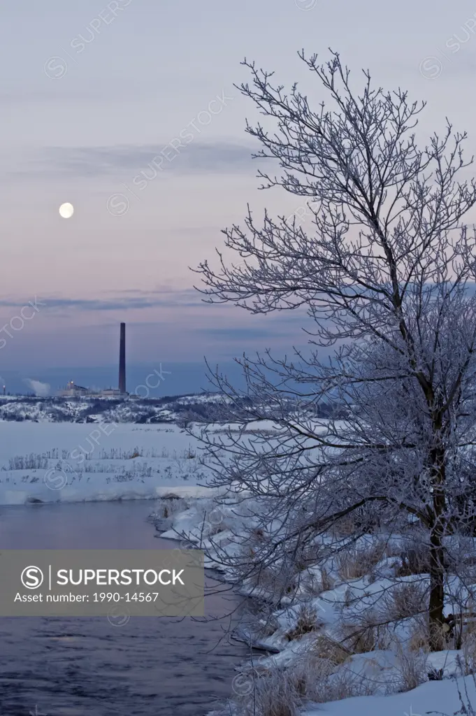 Setting moon over Vale INCO iron ore recovery plant near Kelly Lake, Sudbury, Ontario, Canada