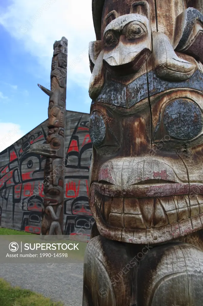Detail of totem pole and longhouses, Ksan Historical Village and Museum, Hazelton, British Columbia, Canada