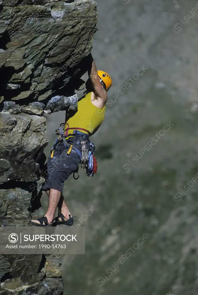 A climber leading a climb at Grand Sentinel, Lake Louise, Banff National Park, Alberta, Canada