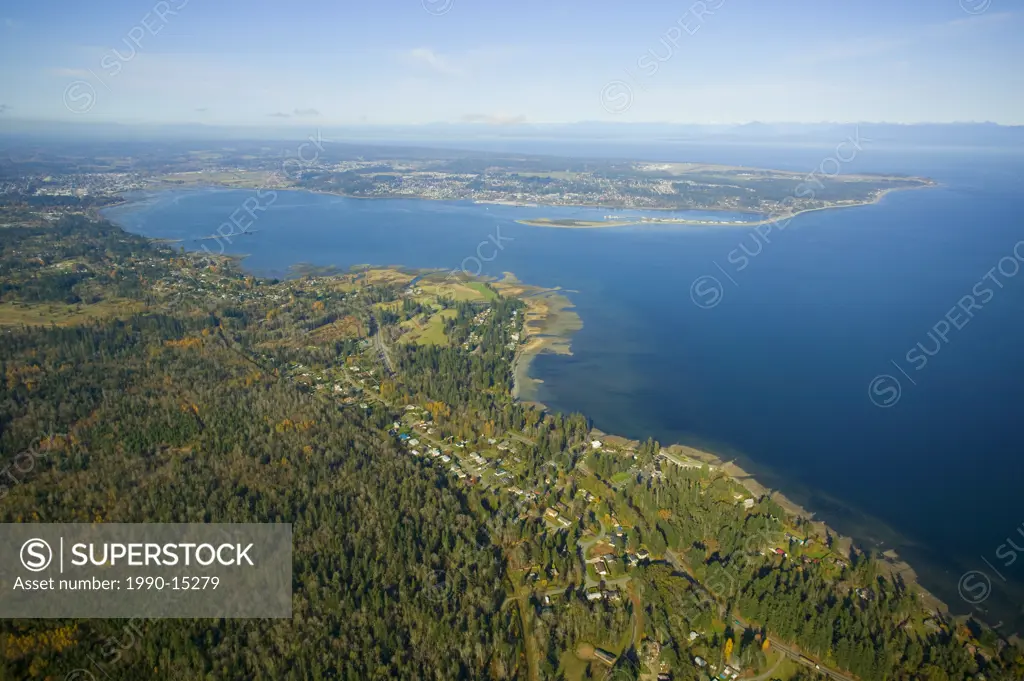 Aerial view of Royston with Comox Bay and the Comox Peninsula and Goose Spit in the background, Georgia Strait and the Coast Mountains in the distance...