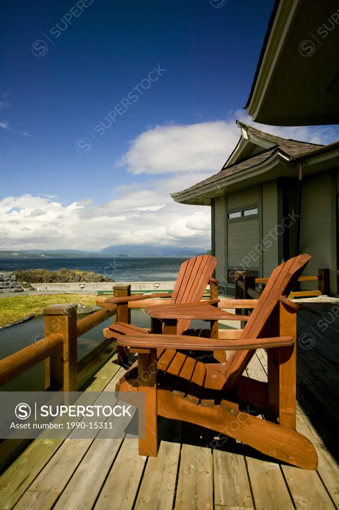 Two adirondack chairs on the deck of the Aveda Concept Spa at April Point on Quadra Island, British Columbia, Canada