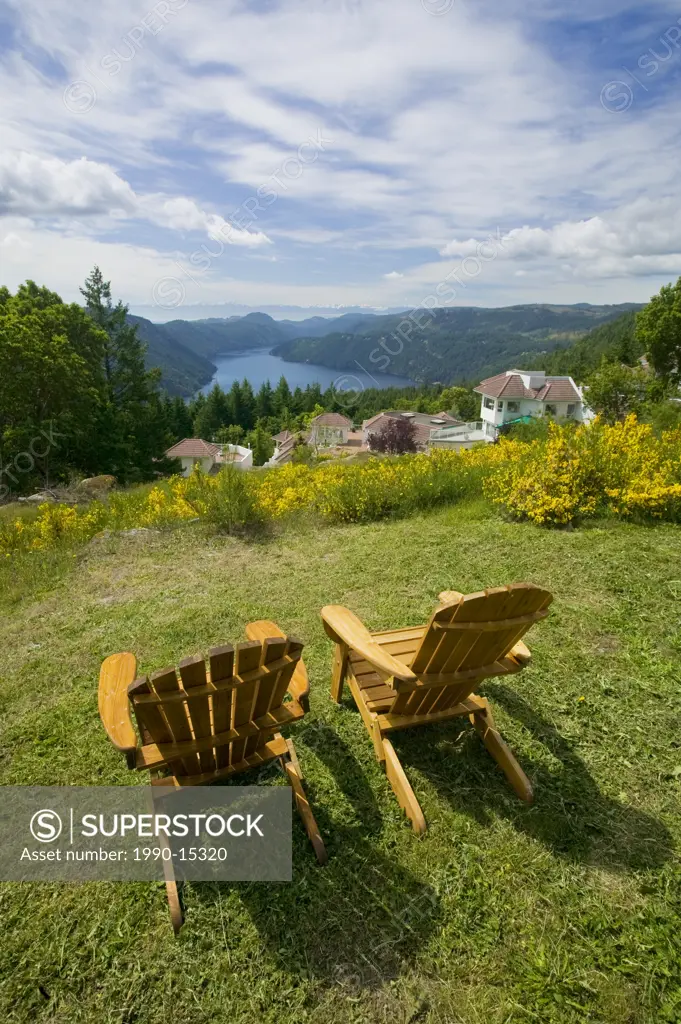 Two adirondack chairs high atop the Malahat, the Aerie Resort commands a breathtaking view of Southern Vancouver Island and the Olympic Mountains in t...
