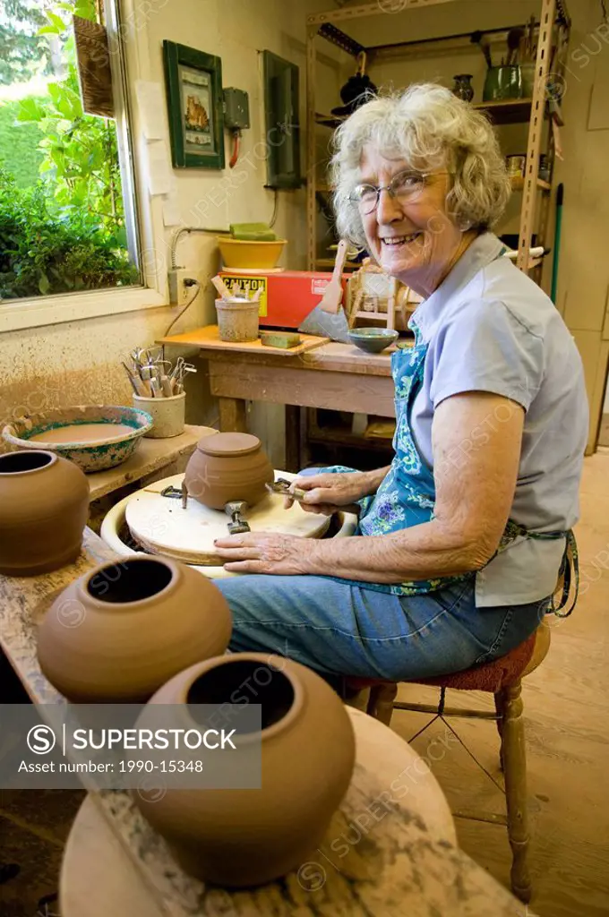 Senior female potter in her studio, Salt Spring Island, Gulf Islands, British Columbia, Canada