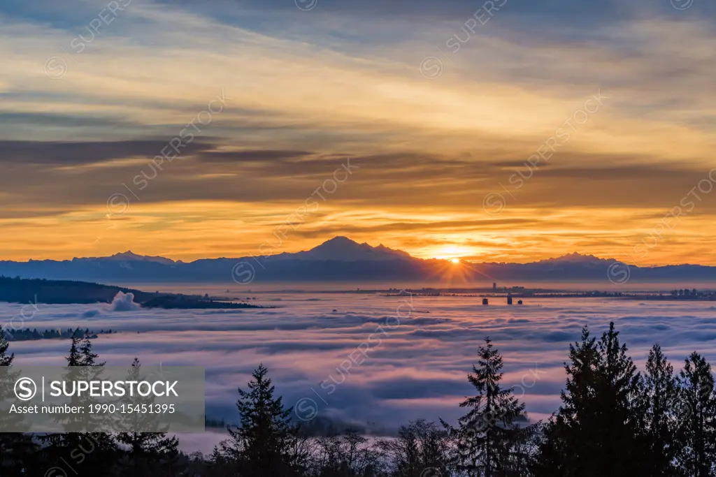 A temperature inversion causes clouds of fog to blanket Vancouver and the Lower Mainland, British Columbia, Canada.