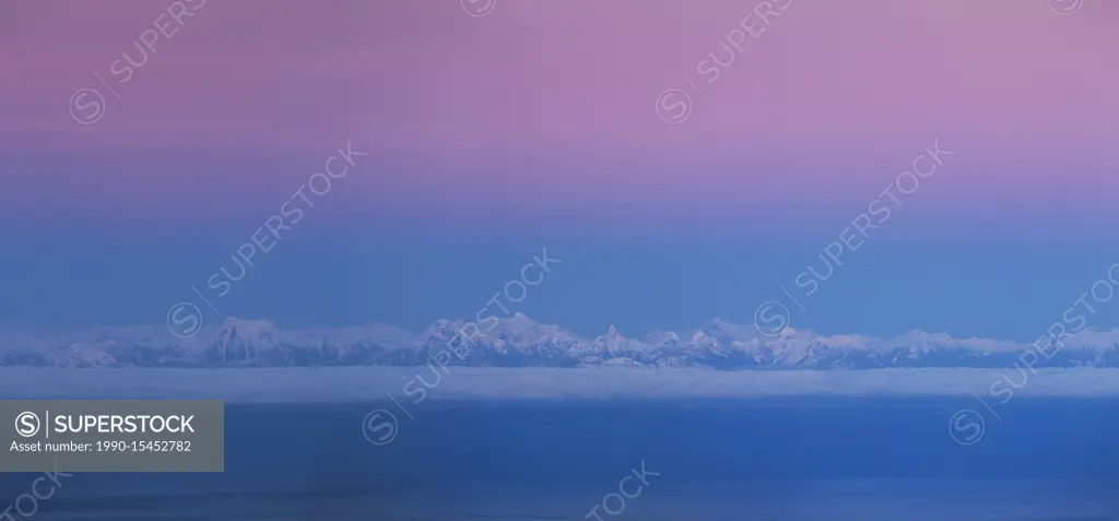 Cold color hues settle over the British Columbia Coast Range after sunset. Coast Mountains, British Columbia, Canada