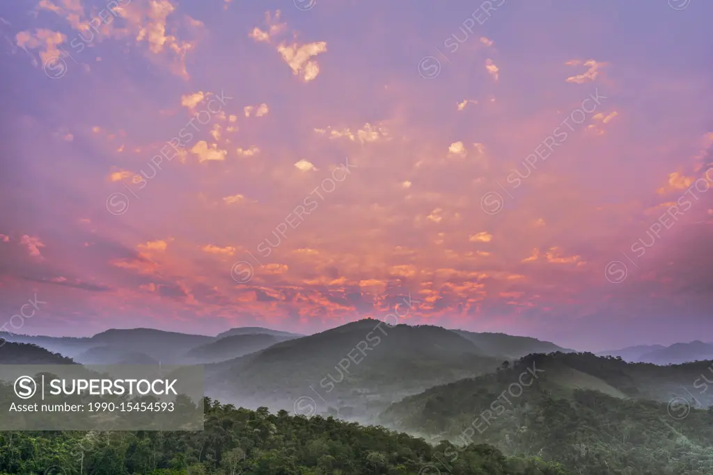 Sunrise in the foothills of the Andes Mountains over the Cordillera Escalera of the Amazon Rainforest near Tarapoto, Peru.