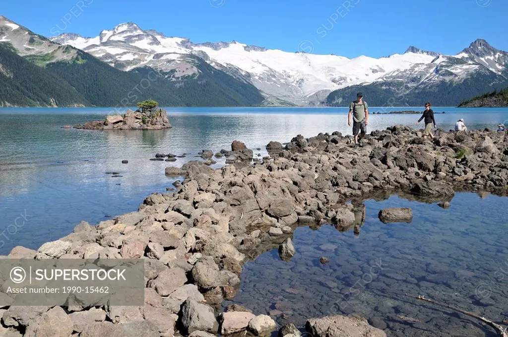 Couple hiking by Garibaldi Lake, Garibaldi Provincial Park, British Columbia, Canada