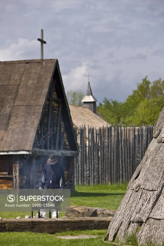 regaliad character tending a fire in the Sainte_Marie Among the Hurons settlement in the town of Midland, Ontario, Canada