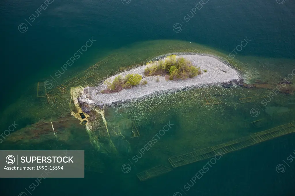 Aerial view of an old abandoned and flooded mine with the mine shaft below the water of Lake Superior, Ontario, Canada