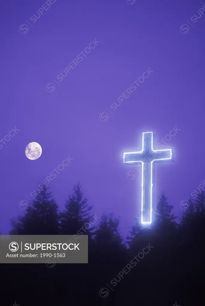 Hillside with illuminated cross, Gaspe Peninsula, Quebec, Canada