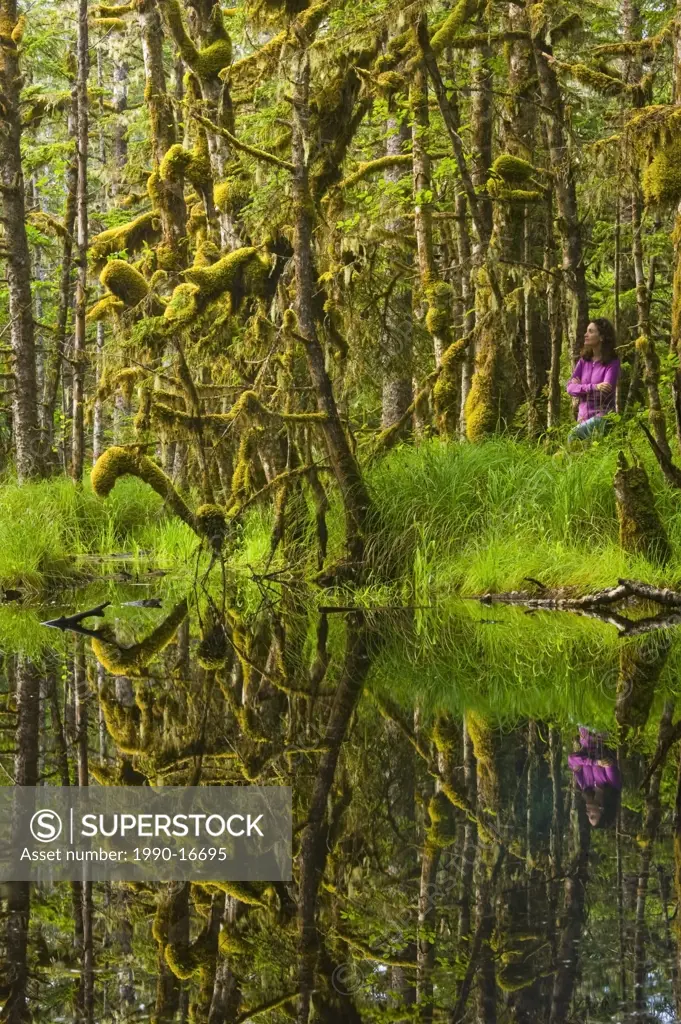Woman in mossy swamp, Naikoon Provincial Park, Queen Charlotte Islands, British Columbia, Canada