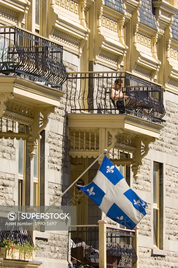 Quebec flag on typical building in Montreal, Quebec, Canada
