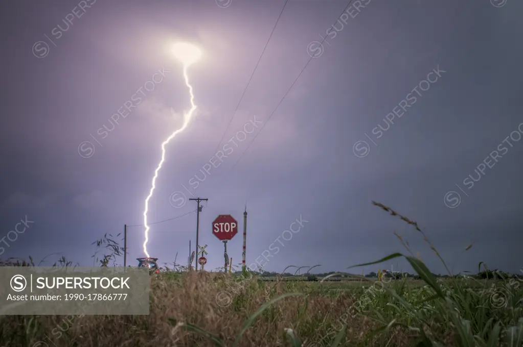 Storm with lightning strikes over a rural field in Oklahoma United States