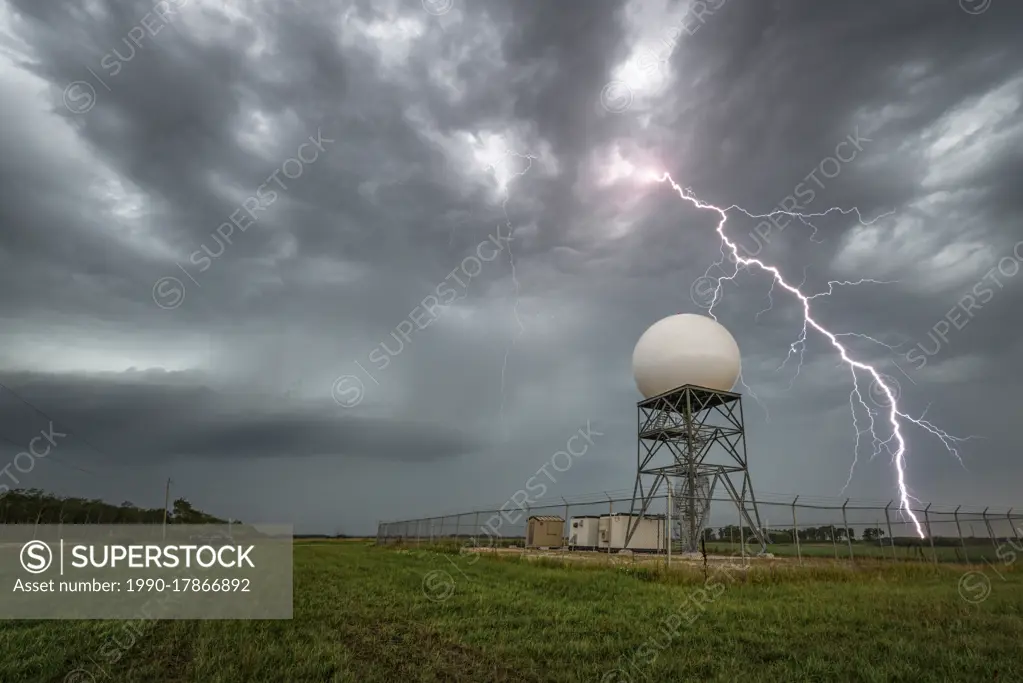 Storm with close range lightning striking near the woodlands radar station in rural Manitoba Canada