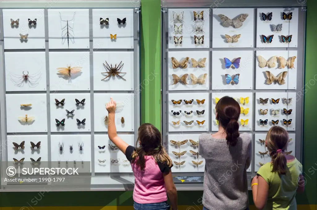 Mother and daughters at Montreal Insectarium, Botanical Gardens, Montreal, Quebec, Canada