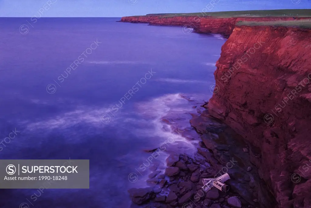 Lobster traps at base of cliff, Cape Tryon, Queens County, Prince Edward Island, Canada