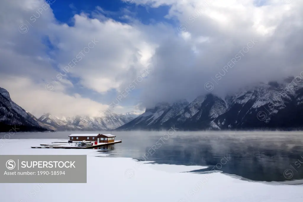 Boathouse in the winter on Lake Minnewanka in Banff National Park in the Canadian Rocky Mountains