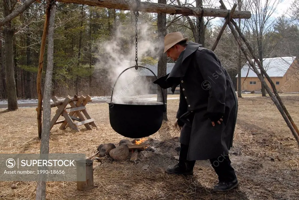 Demonstration of syrup production in the traditional way, Westfield Heritage Village, Ontario, Canada