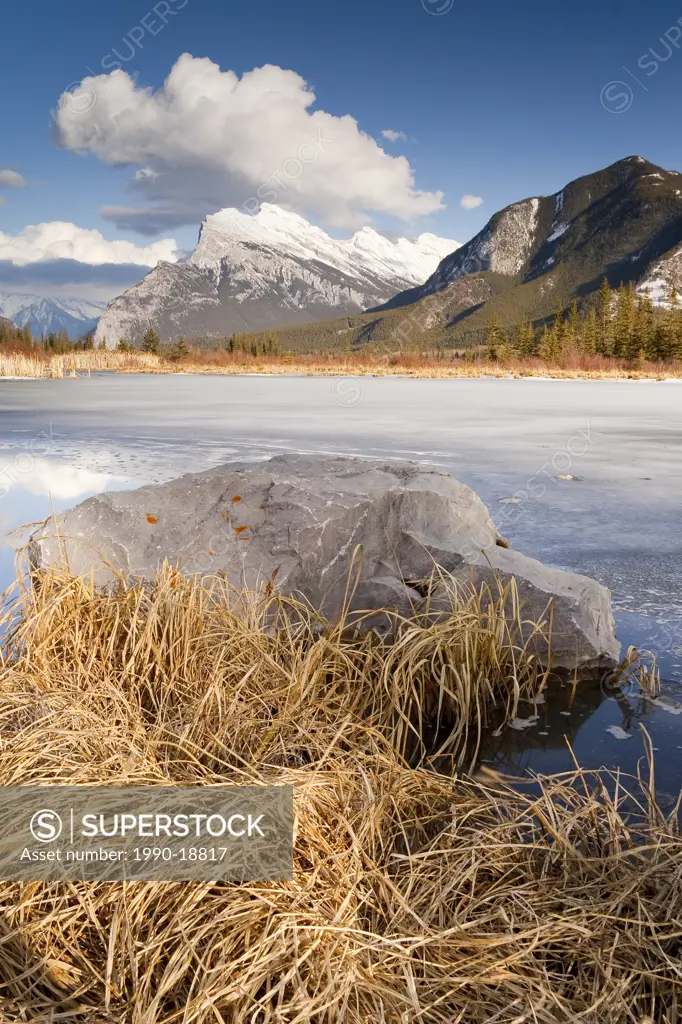 Partly frozen Vermillion Lake and Mt. Rundle, Alberta, Canada