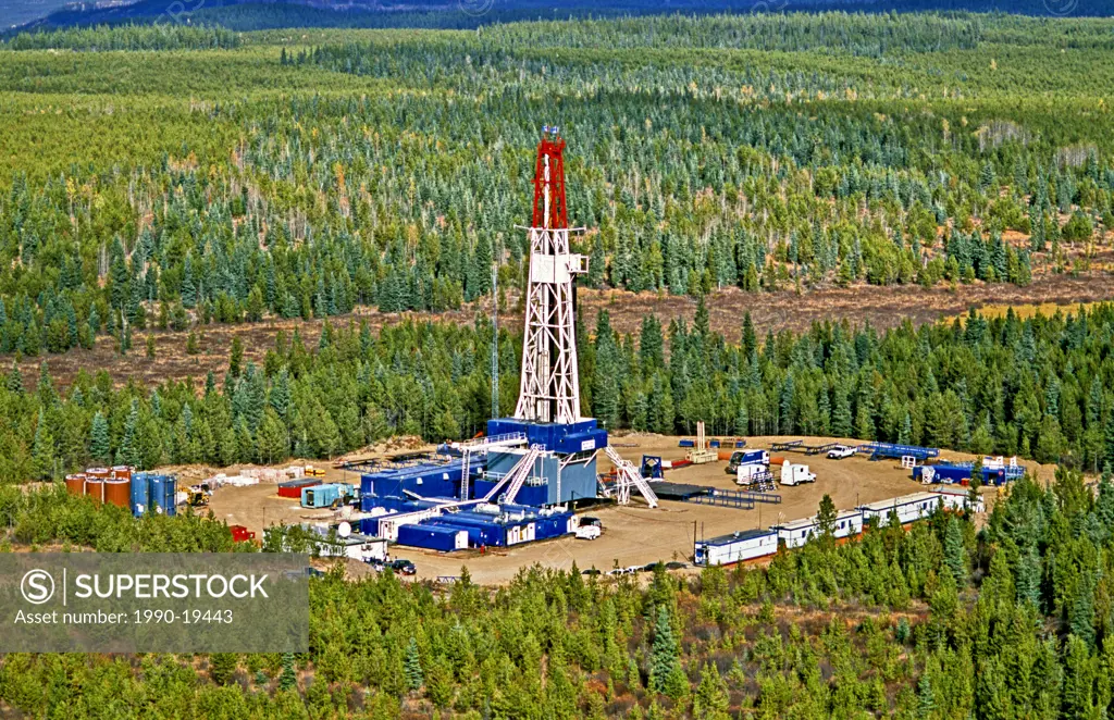 Aerial image of a surface drill rig seeking natural gas and crude oil in the northern wilds of Alberta Canada