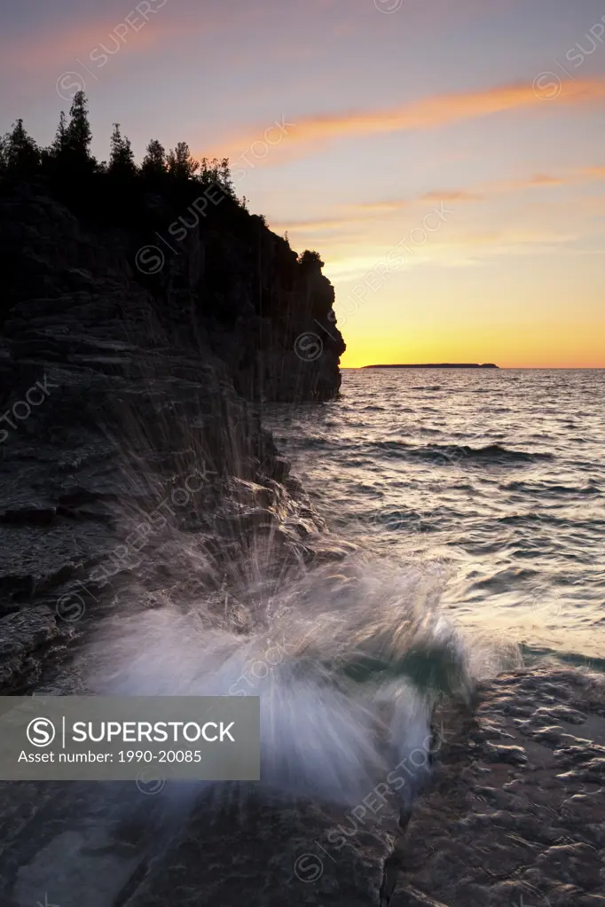 A view of the Indian Head at Indian Head Cove at sunset on the Georgian Bay side of the Bruce Peninsula, Ontario, Canada