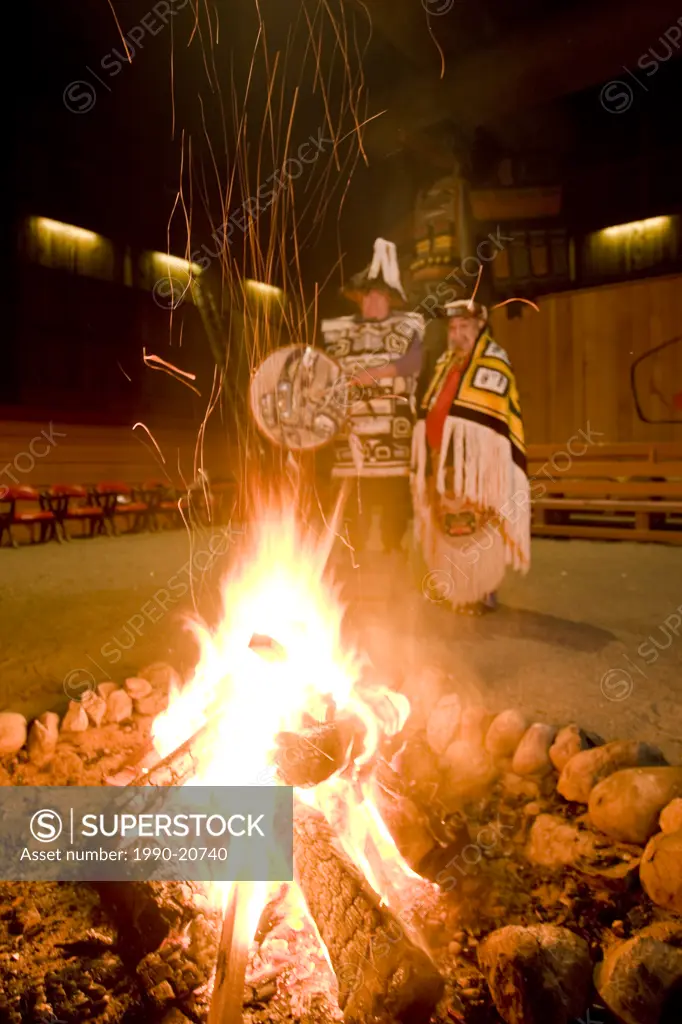 Two Hereditary chiefs preside over a fire in the longhouse in Port Rupert. Port Rupert, Vancouver Island, British Columbia, Canada.