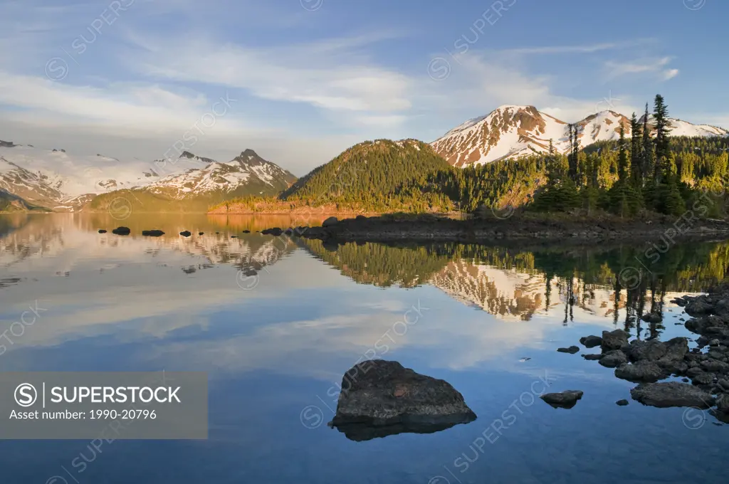 Mount Price and Clinker Peak right and the Sphinx Glacier left at sunset provide a beautiful backdrop to Garibaldi Lake and the Battleship Islands in ...