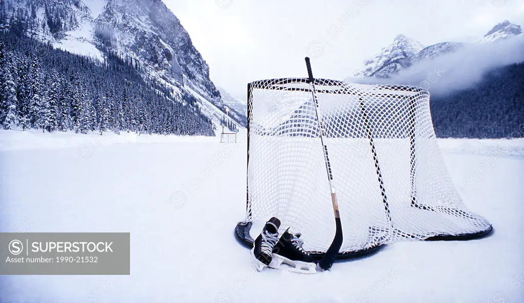 Ice skates, hockey stick and hocky net on Lake Louise, Banff National Park, Alberta, Canada.