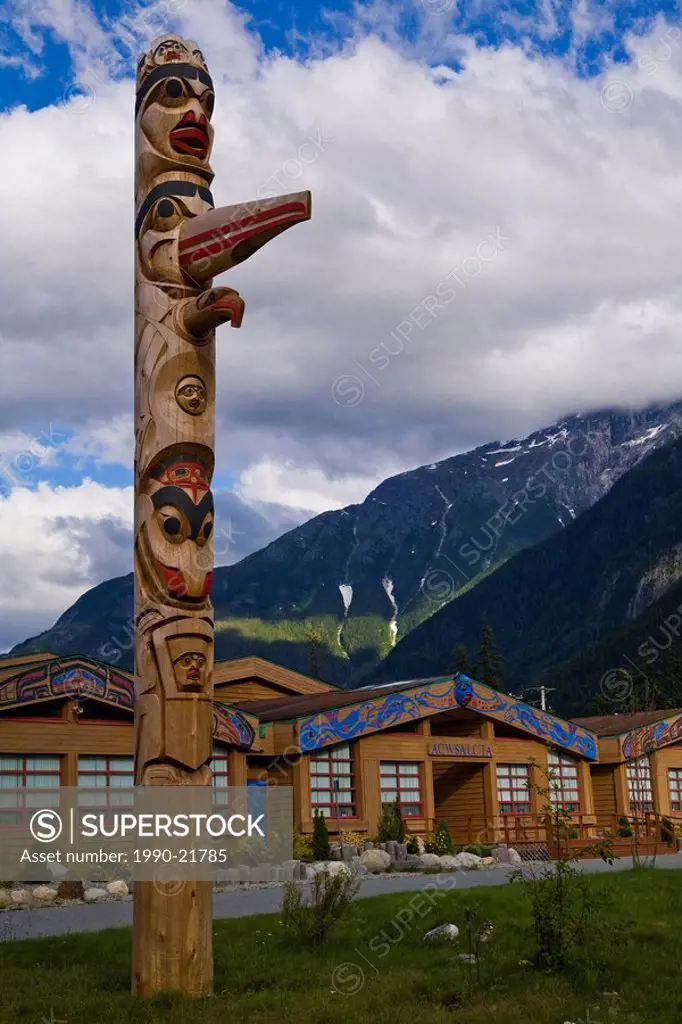 Totem Pole in front of a School, Bella Coola Valley, BC, Canada