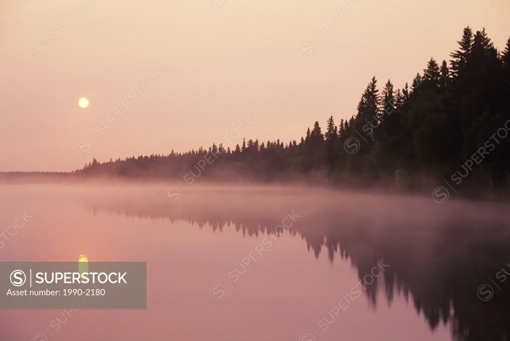 Sunrise and mist over Duck Mountain Provincial Park, Manitoba, Canada