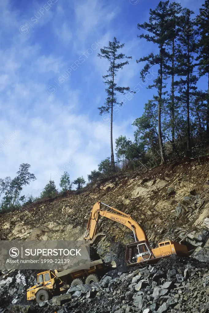 Earth moving equipment moves rock, British Columbia, Canada