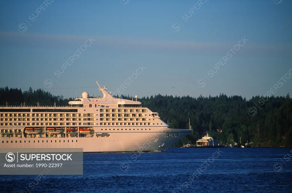 Passenger cruise ship in Johnstone Stait, near Campbell River, Quadra Island behind, British Columbia, Canada