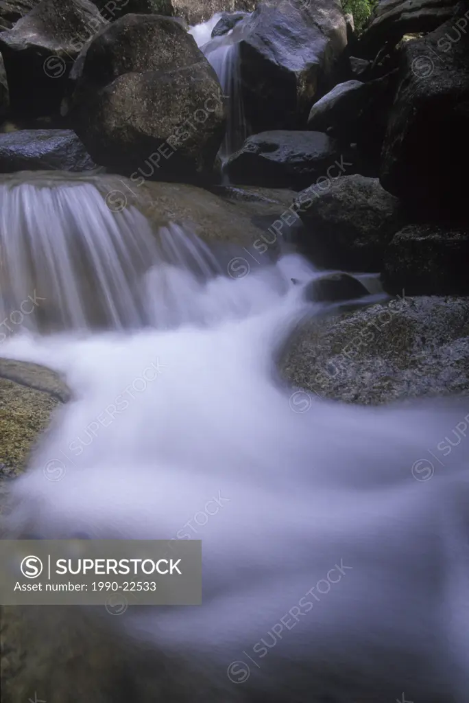 Fresh water over granite boulders, Shannon Falls Park, Squamish, British Columbia, Canada