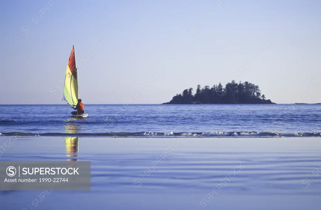 Small sailboat launches off beach, Pacific Rim, Tofino, Vancouver Island, British Columbia, Canada