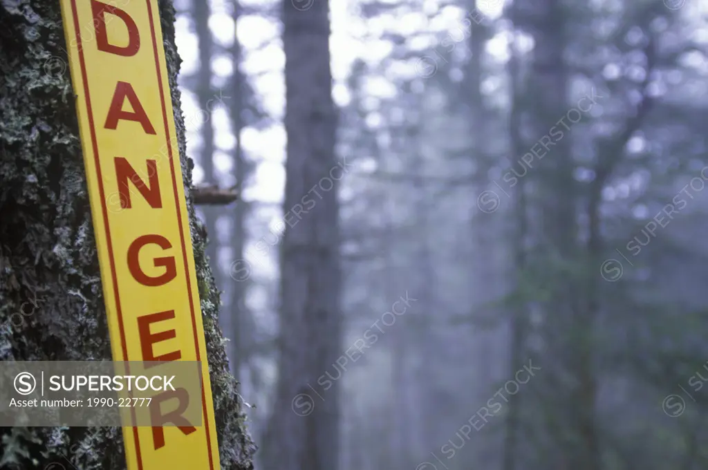 Danger sign in the woods, British Columbia, Canada