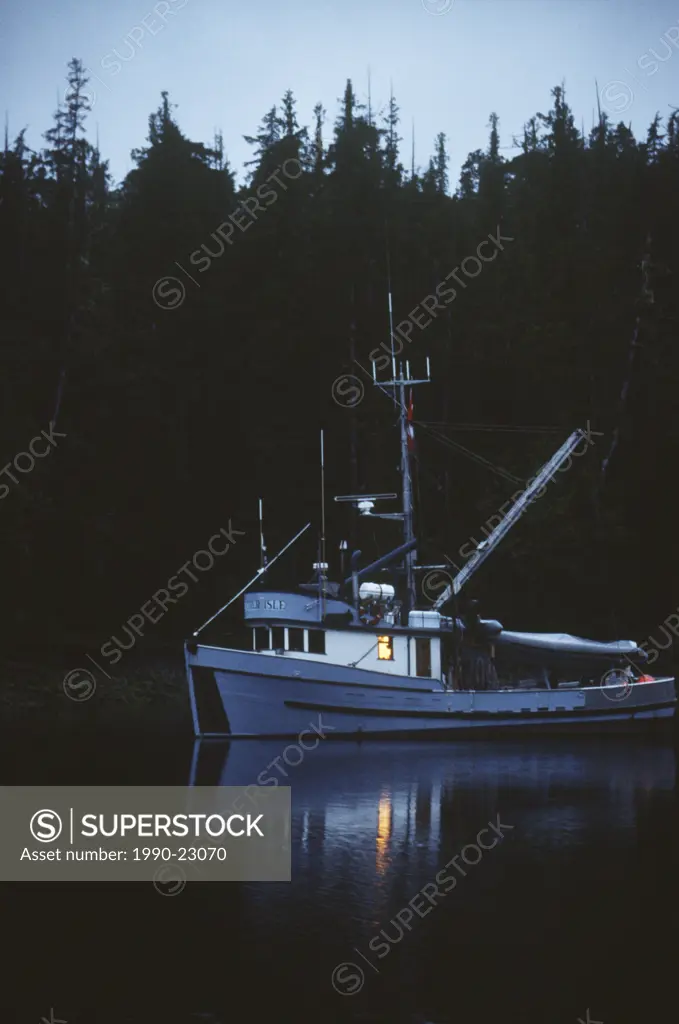 Central Coast , fishing vessel porcher isle at snug anchorage at twilight, British Columbia, Canada