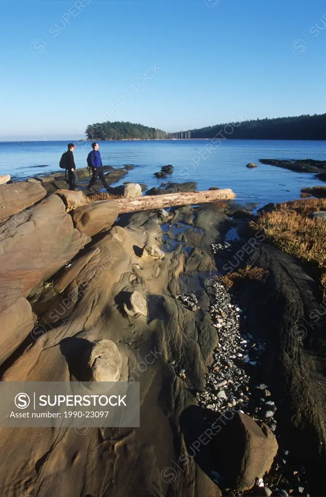 man and boy on beach at low tide, Gulf Islands, Cabbage Island, British Columbia, Canada