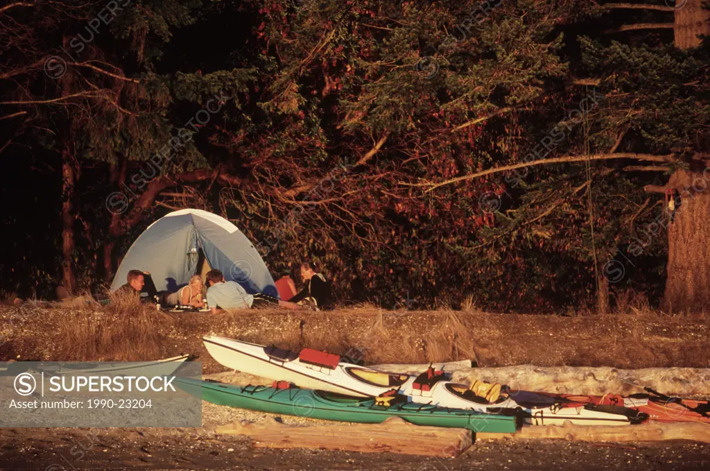 kayakers camping at shell beach, Portland Island, Gulf Islands National Park Reserve, British Columbia, Canada