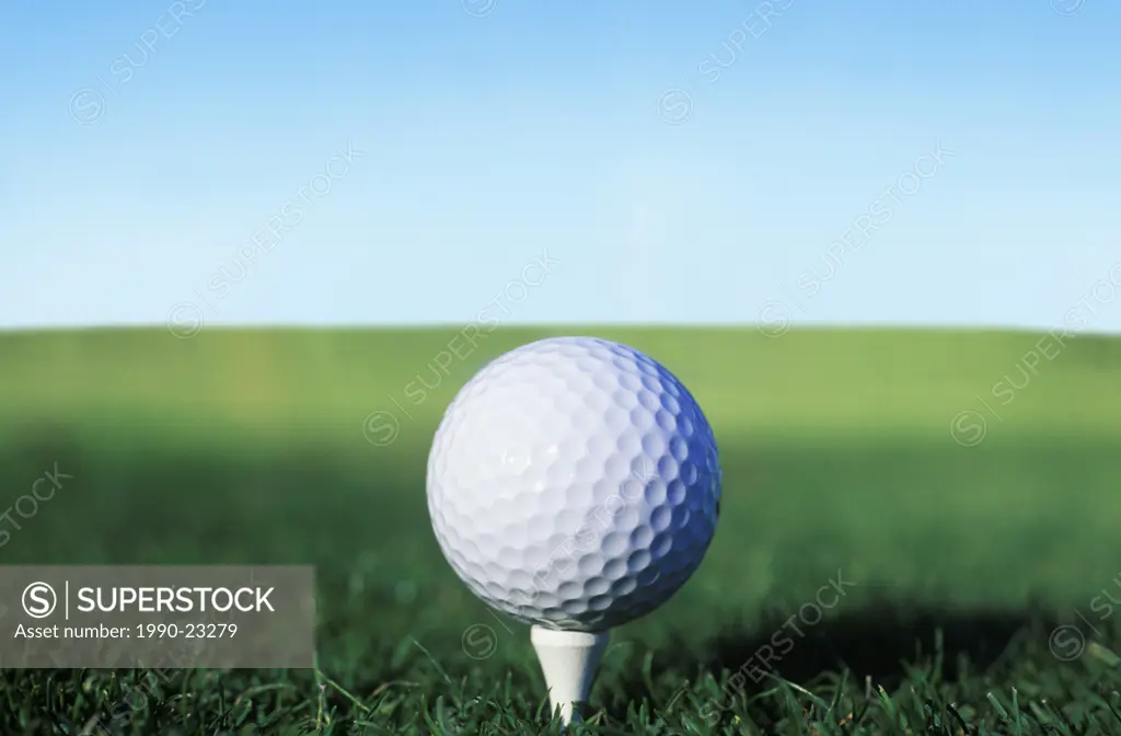 Golf Ball on tee awaiting drive, British Columbia, Canada