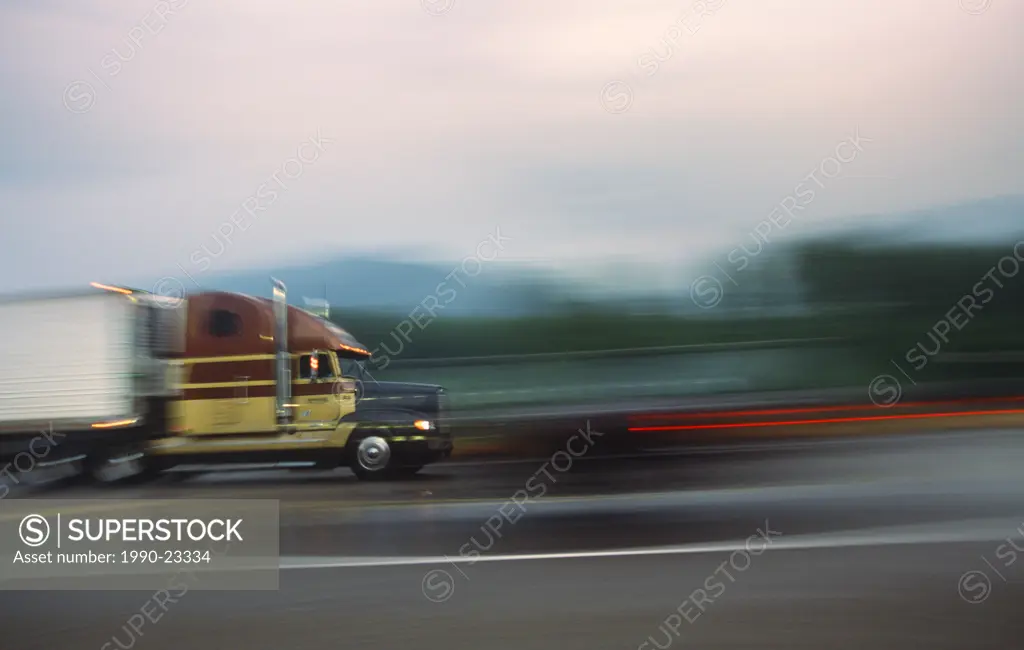 Blurred shot of transport truck on highway, British Columbia, Canada