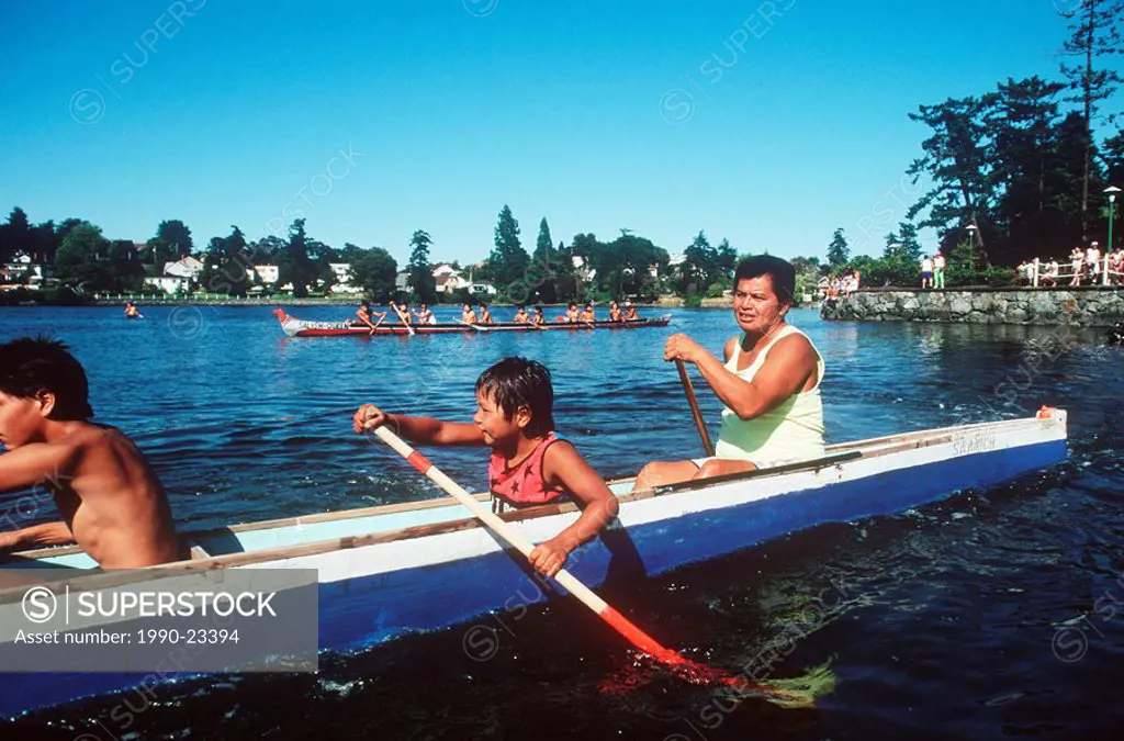 First Nations culture, Salish paddling team, father and son, British Columbia, Canada