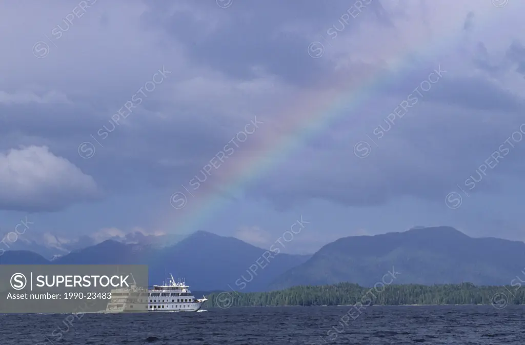 small cruise ship and rainbow, Spiller Channel, Central Coast along Inside Passage, British Columbia, Canada