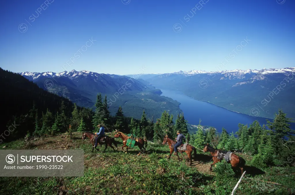 Kootenays near New Denver, Idaho Peak, horseback trail riders, Slocan Lake, British Columbia, Canada