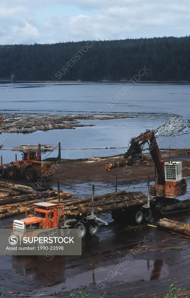 Transport truck being loaded at a log boom, British Columbia, Canada