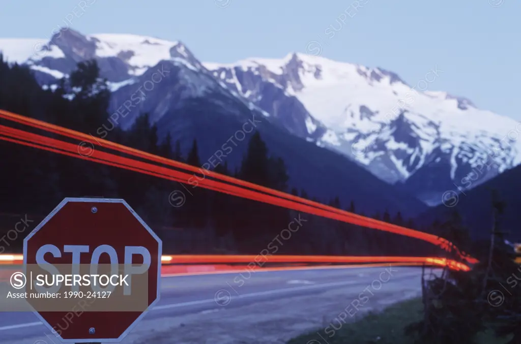 Rogers Pass, time exposure of highway at stop sign, British Columbia, Canada
