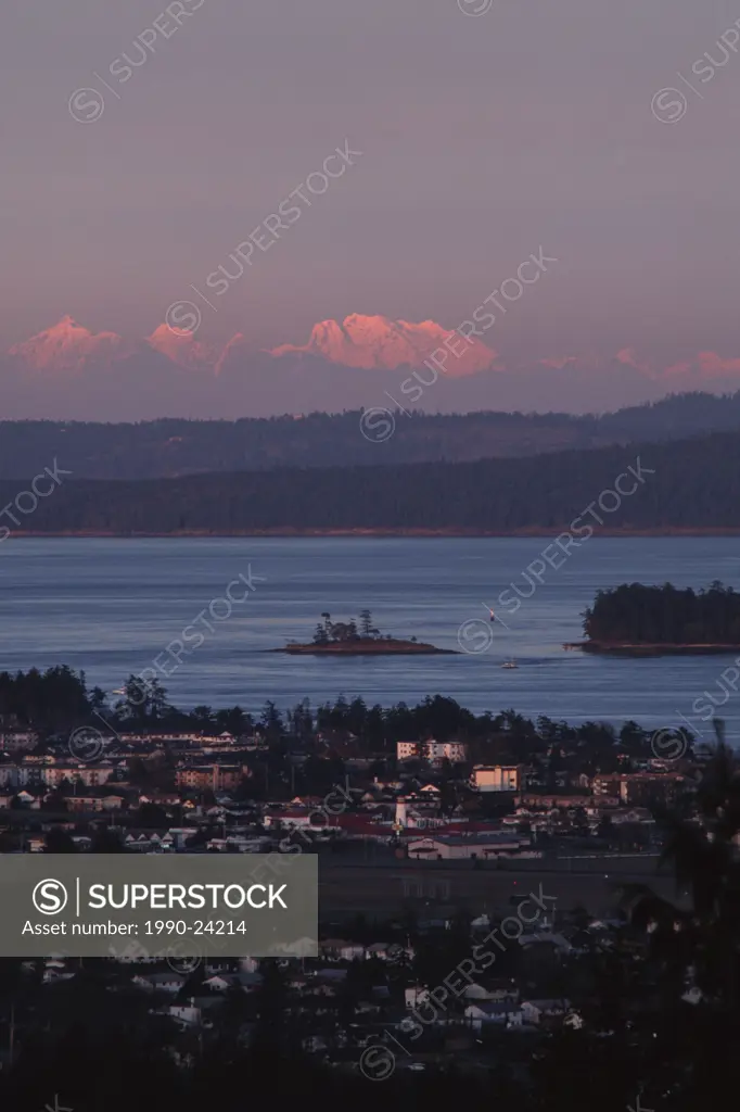 View of Sidney at dusk with Coast Mountains beyond, Vancouver Island, British Columbia, Canada