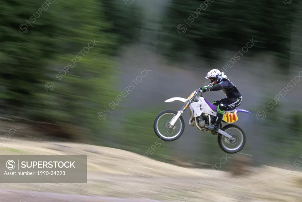 Motocross rider takes ´air´ on dirt track, British Columbia, Canada